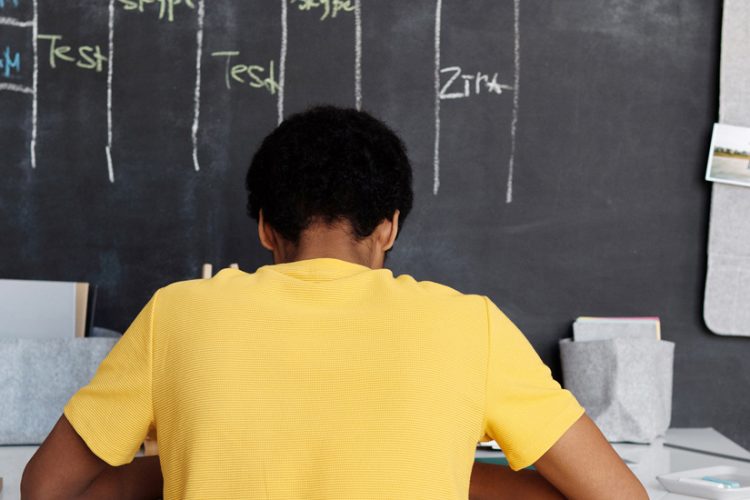 Child Sitting at Desk